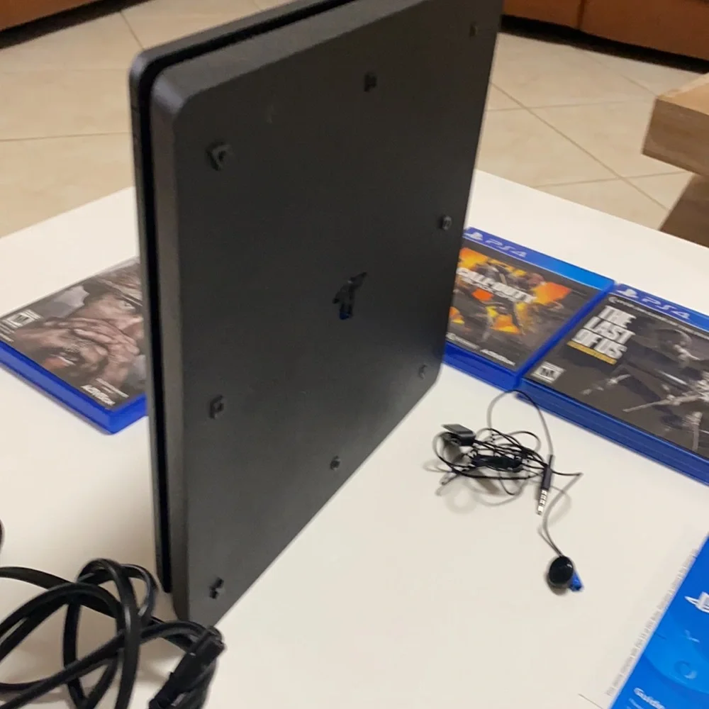 PlayStation 4 Slim 1TB Console and 5 Games
